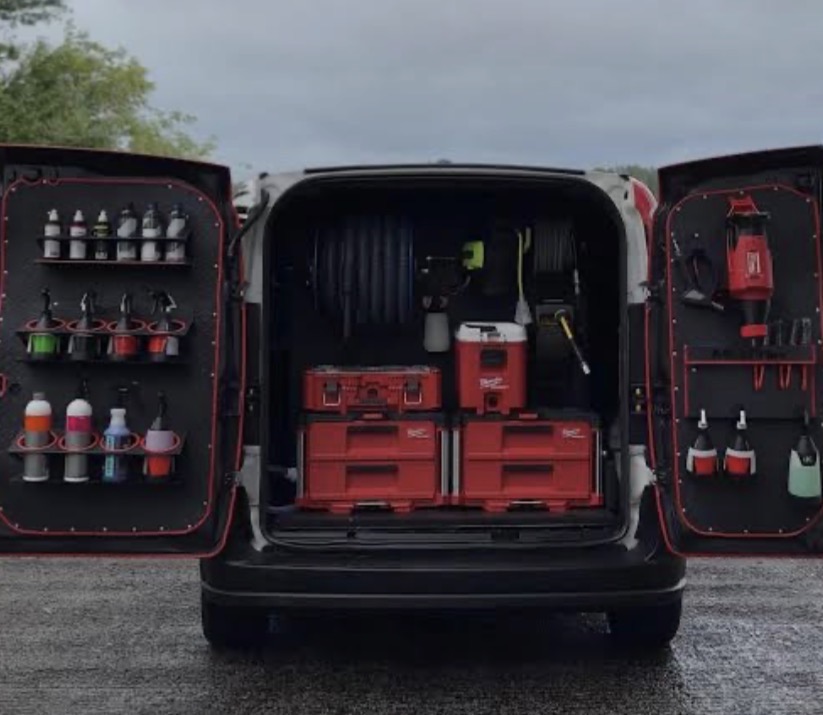 Open detailing van with organized tools and cleaning supplies